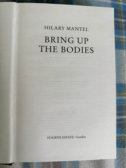 First edition Bring Up The Bodies Hilary Mantel title page on a patterned background