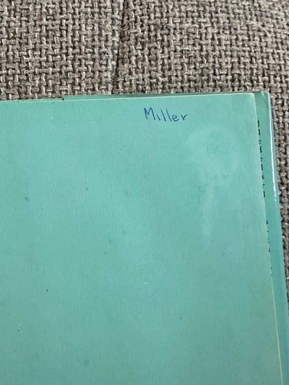 Lady Filmy Fern first edition book cover in green with handwritten name Miller on the side