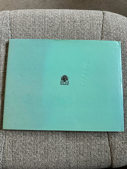 Lady Filmy Fern first edition book with a mint green cover and simple logo on the front