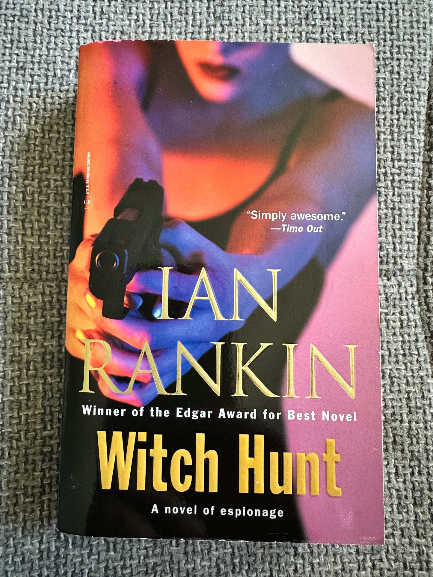 Signed first edition Witch Hunt Ian Rankin book cover featuring a woman with a gun in a crime thriller setting