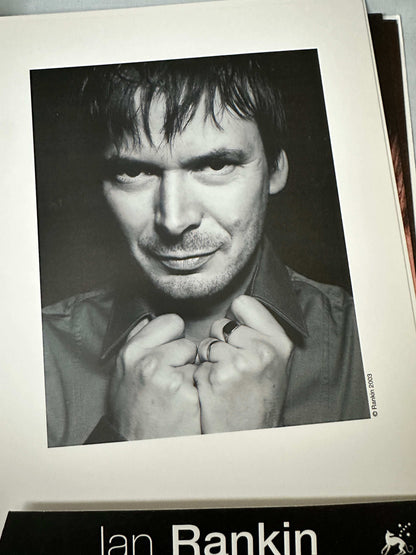 Ian Rankin signed press pack featuring a black and white portrait of the author with a thoughtful expression