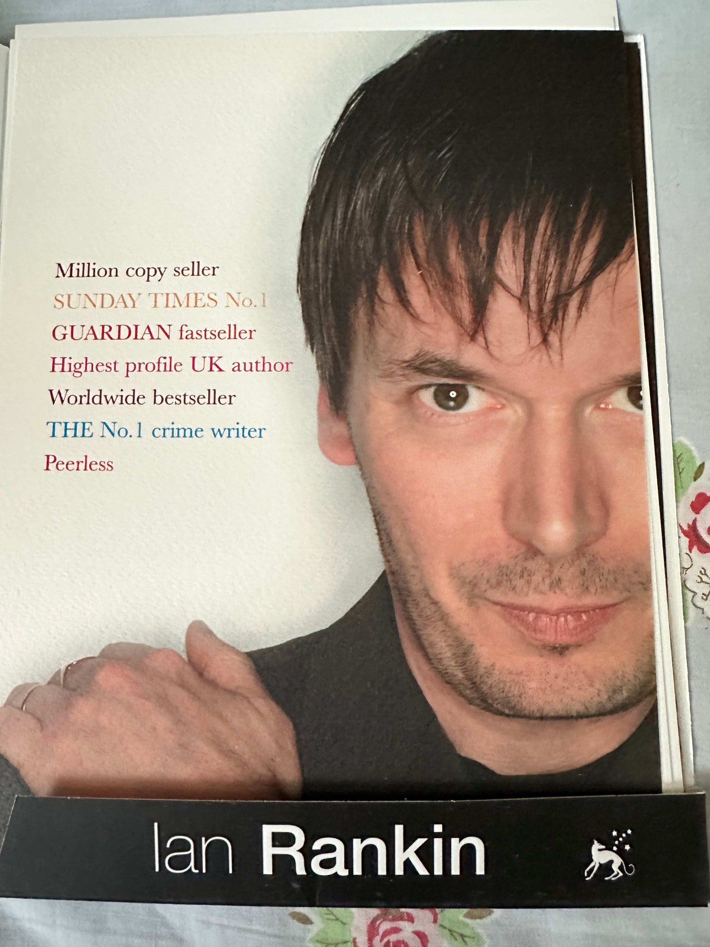 Ian Rankin signed press pack featuring a promotional image and accolades for the crime writer