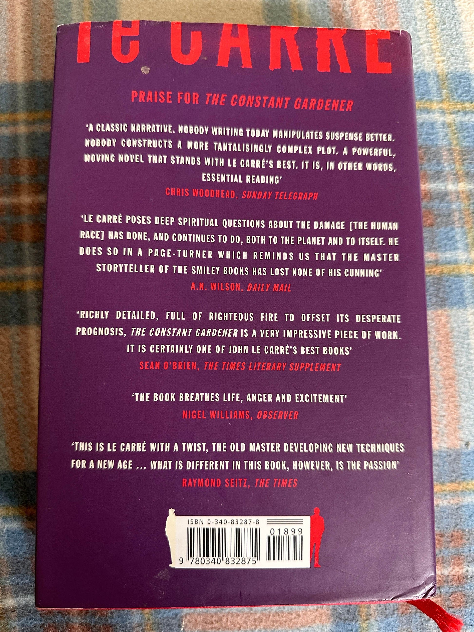 Absolute Friends first edition John le Carre book cover featuring praise and reviews on the back