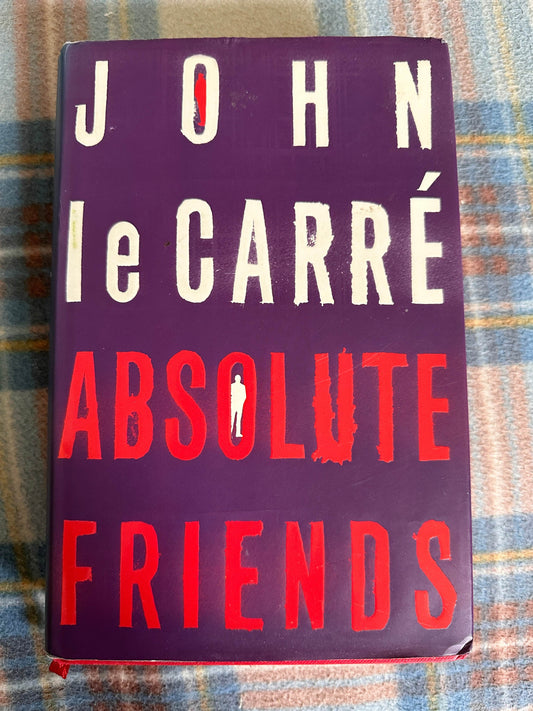 Absolute Friends first edition John le Carre book cover featuring bold purple and red design
