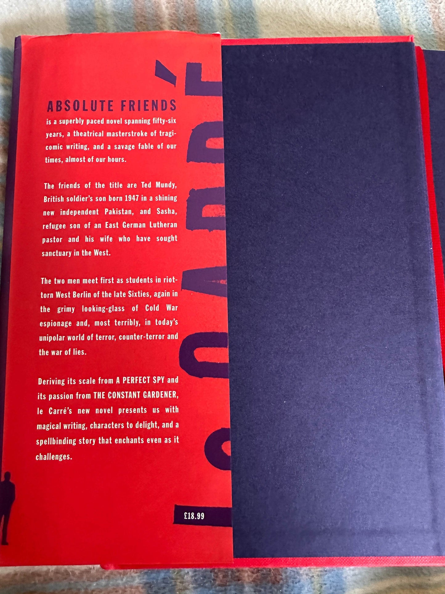 Absolute Friends first edition John le Carre book cover showcasing a striking red and black design