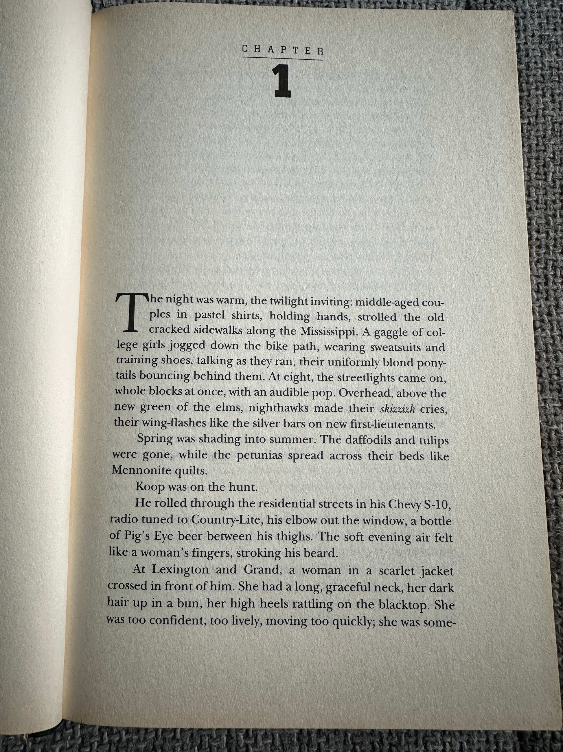 First edition of Night Prey John Sandford with chapter one text on an open page