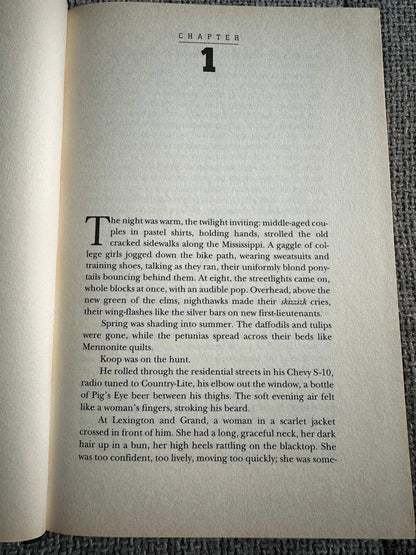 First edition of Night Prey John Sandford with chapter one text on an open page