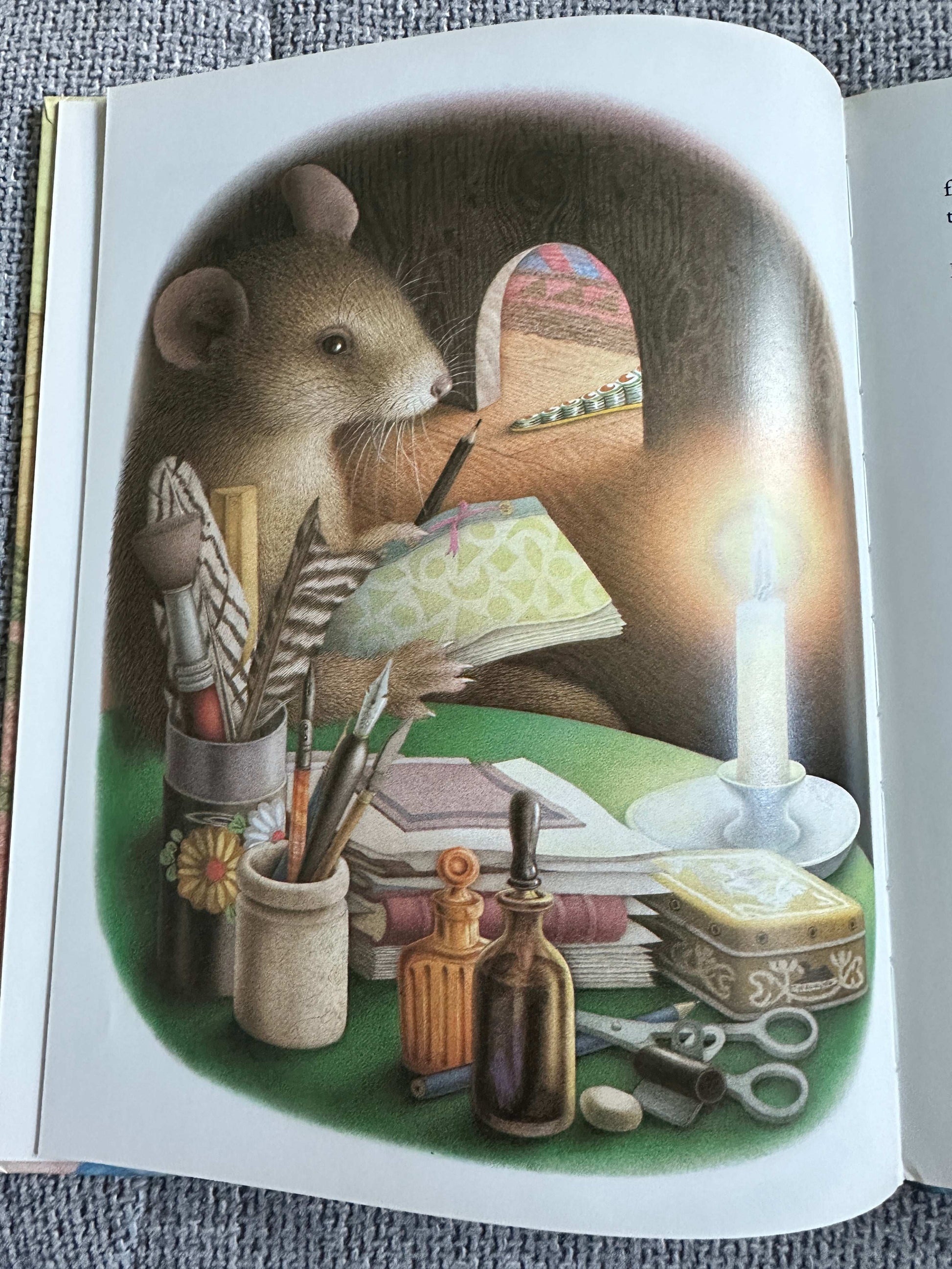 Illustration from La Corona and The Tin Frog first edition featuring a mouse writing at a desk with art supplies