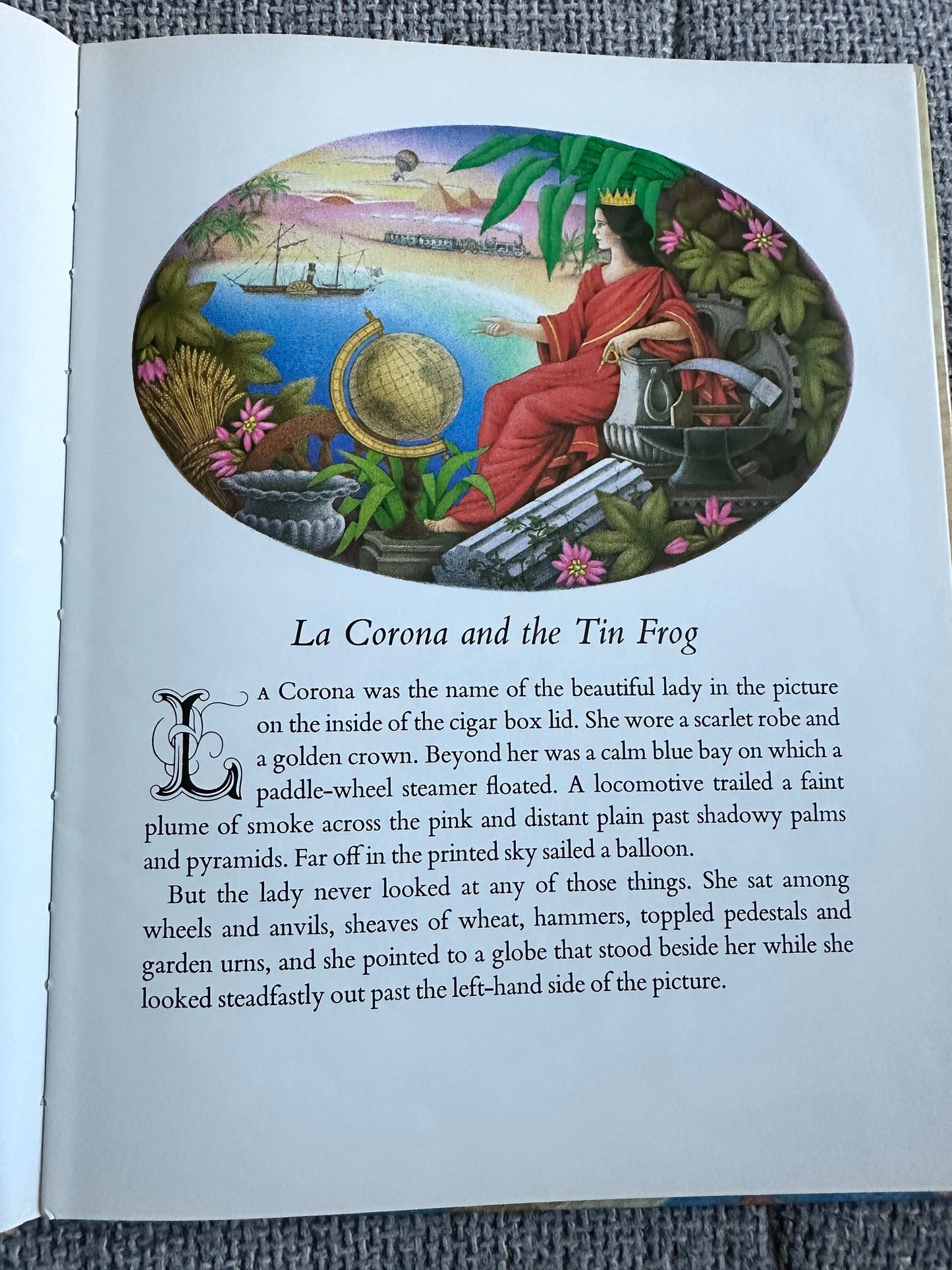 First edition of La Corona and The Tin Frog featuring a colorful illustration of a lady by the water