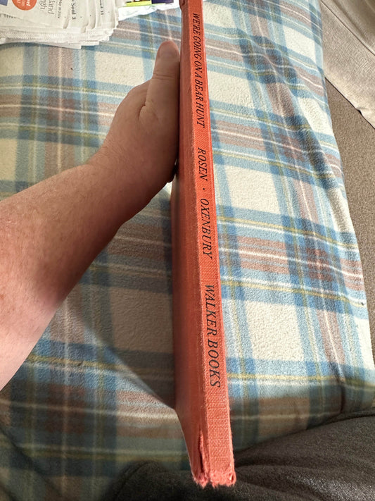 Side view of Michael Rosen Helen Oxenbury rare book with an orange spine showcasing publisher details