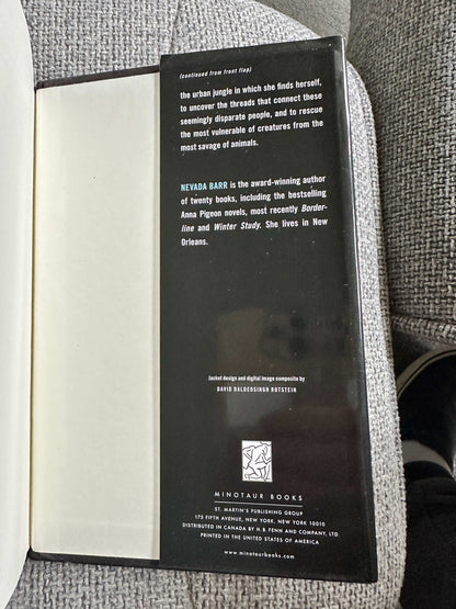 Back cover of Nevada Barr Burn first edition showcasing author bio and publisher details