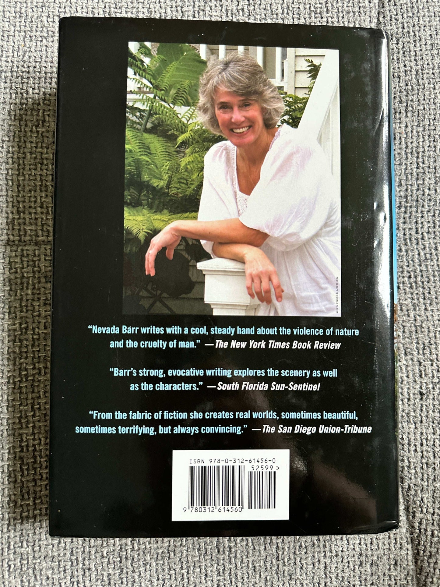 Back cover of Nevada Barr Burn first edition featuring author and quotes about her writing style