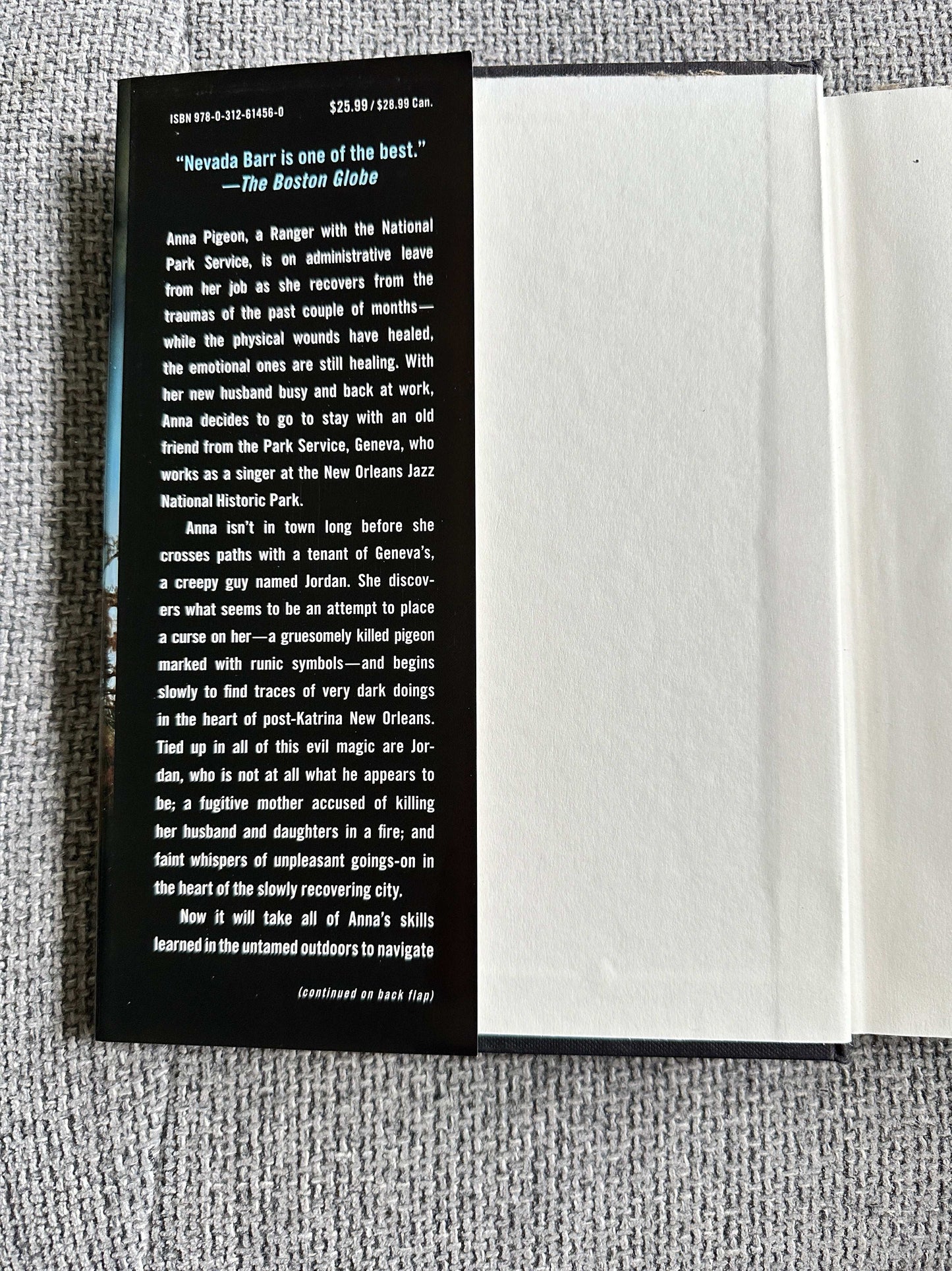 Nevada Barr Burn first edition book interior showcasing praise from The Boston Globe about Anna Pigeon