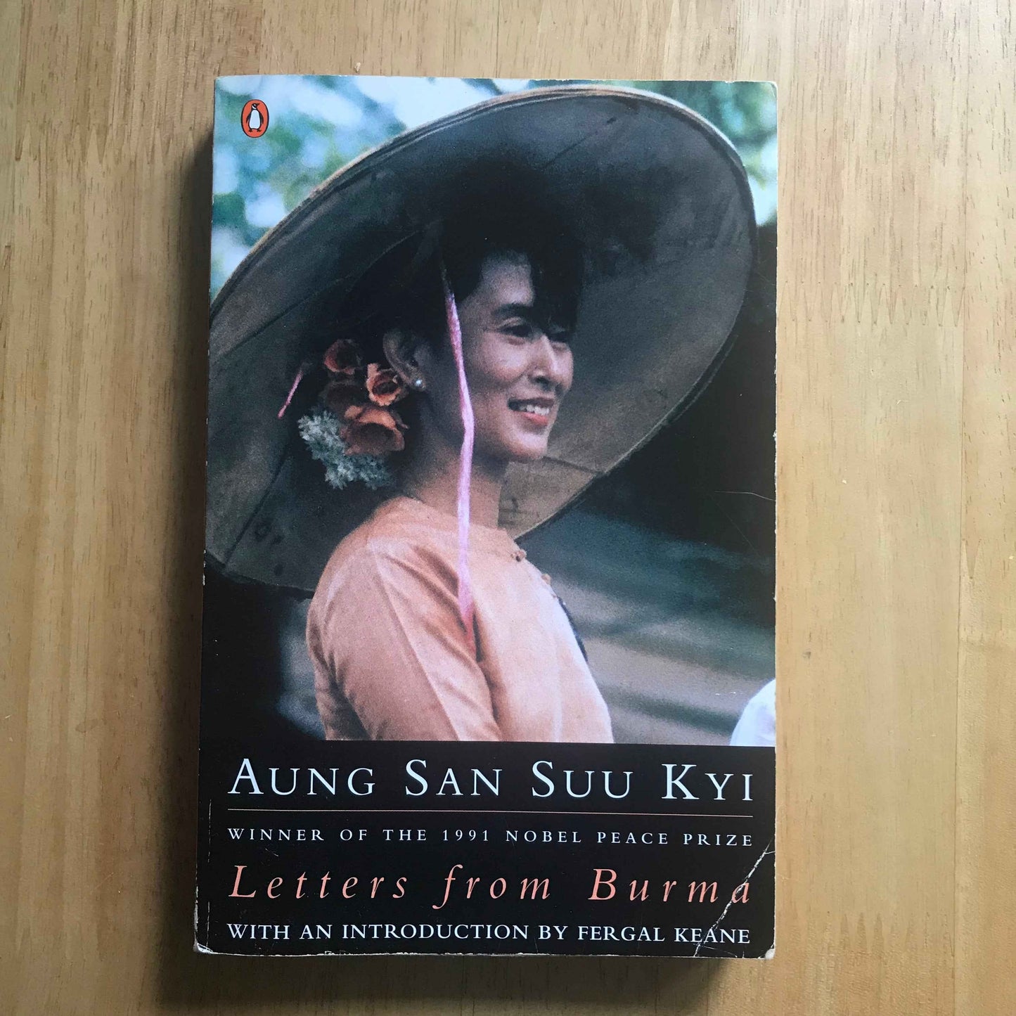Letters from Burma Aung San Suu Kyi book showing paperback cover portrait of Aung San Suu Kyi in a wide hat