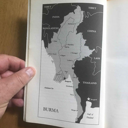 Hand holding open book showing black and white map of Burma and neighbors in Letters from Burma Aung San Suu Kyi book