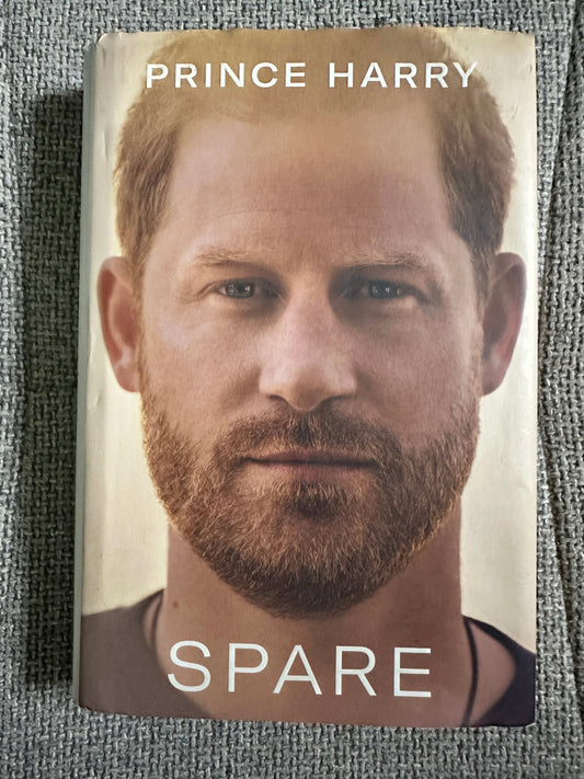 2023 Prince Harry memoir for sale titled Spare featuring a close-up of Prince Harry on the cover
