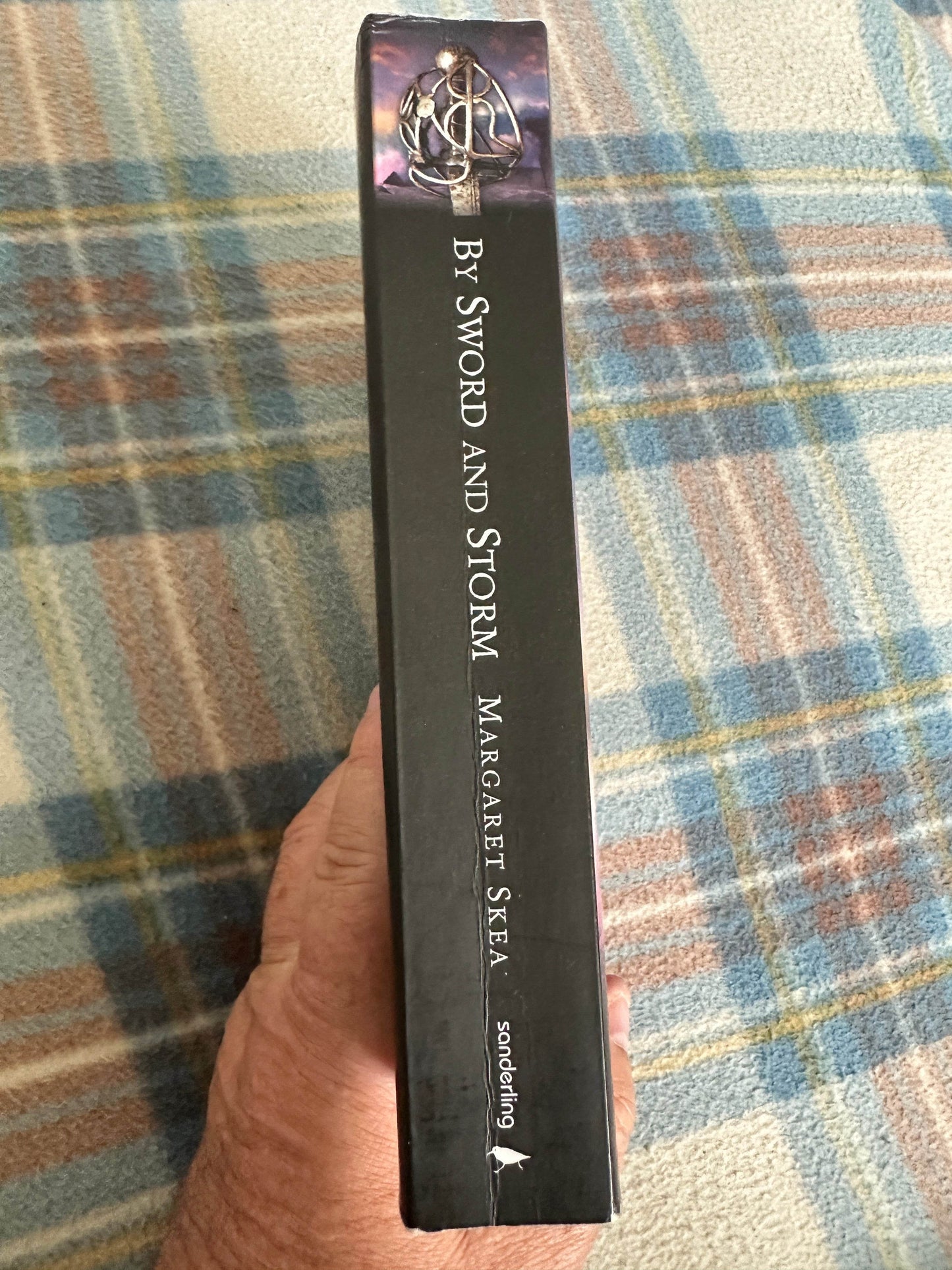 Signed By Sword and Storm Margaret Skea book spine showing title and author for fiction lovers
