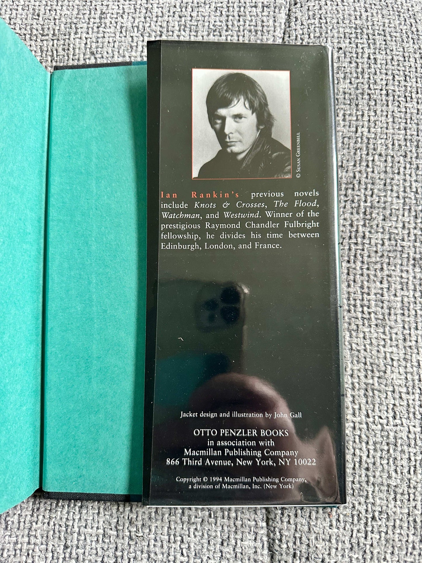 Back cover of Ian Rankin's signed first edition book showcasing author portrait and publishing details