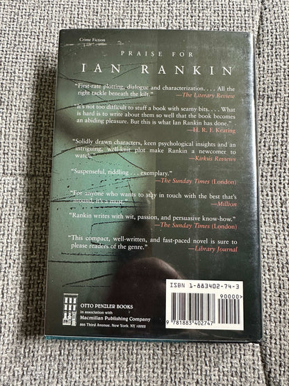 Signed Ian Rankin first edition of Crime Detective novel with detailed reviews on the back cover