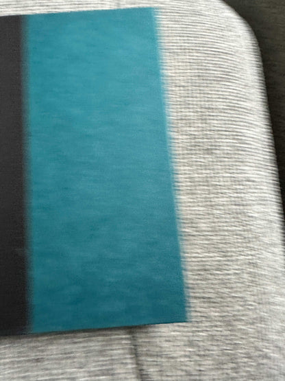 Signed Ian Rankin first edition book featuring a striking teal and black cover design