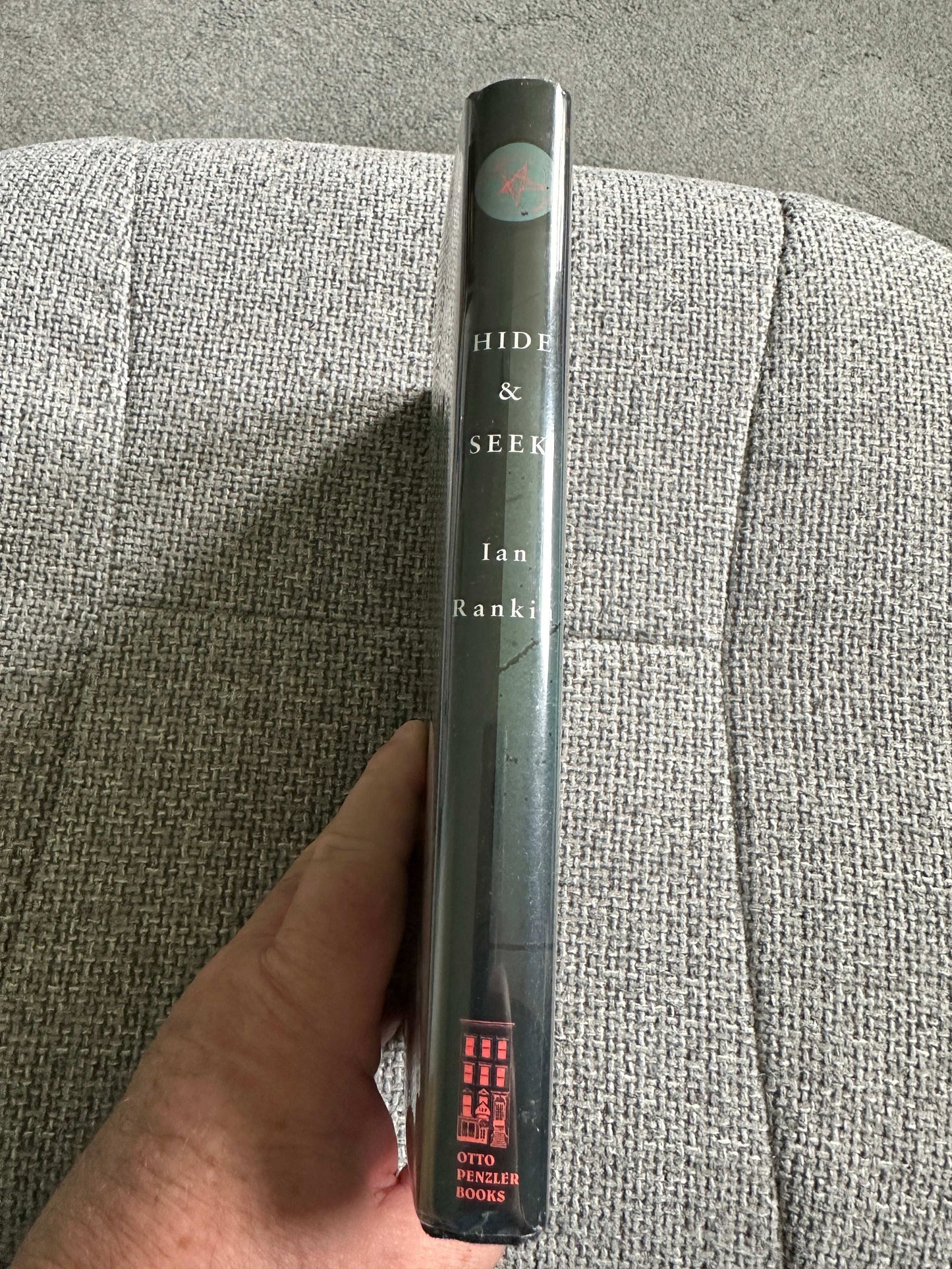 Signed Ian Rankin first edition book 'Hide & Seek' showcasing its spine with titles and publisher details