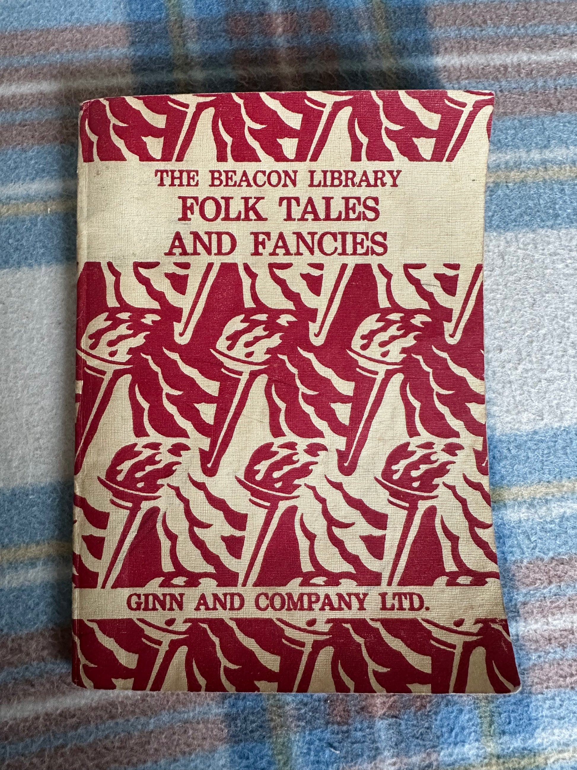 The Beacon Library Folk Tales and Fancies children's book with vibrant red cover design featuring torches