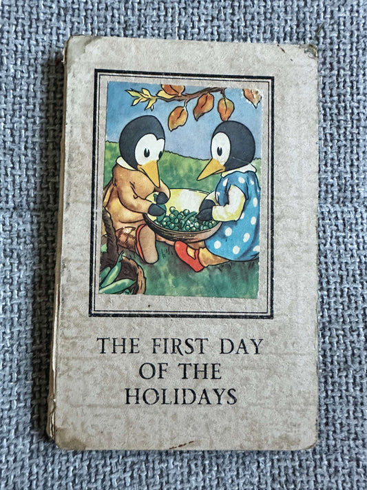 The First Day of the Holidays vintage children's book with charming penguin illustration on the cover