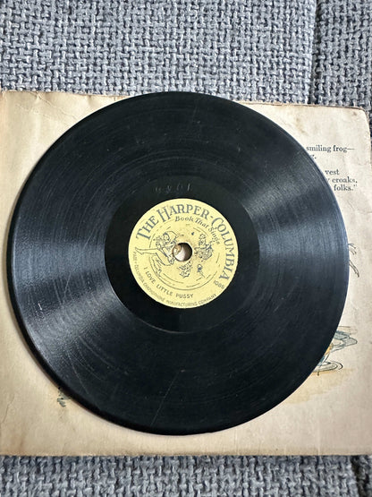 The Funny Froggy Bubble Book first edition featuring a vintage vinyl record on an antique book page
