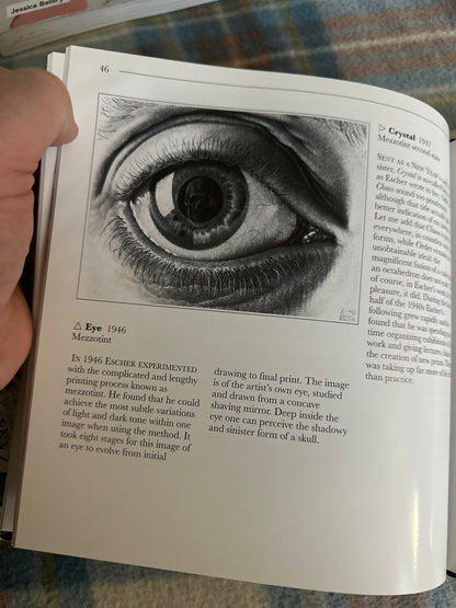 The Life and Works of Escher Parragon book page featuring an eye artwork and detailed description