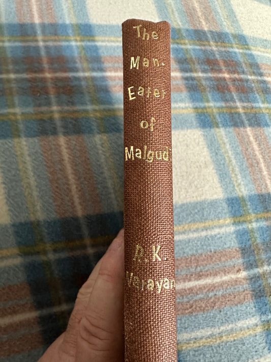 Spine of The Man-eater of Malgudi vintage book by R.K. Narayan, featuring gold lettering