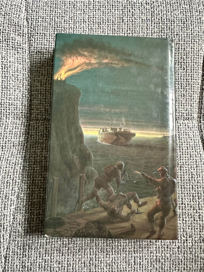 The Volunteers Douglas Reeman first edition book cover featuring a battle scene by the sea