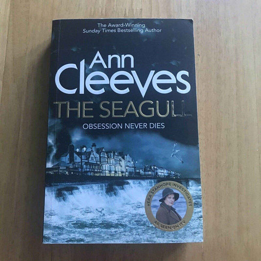 The Seagull Ann Cleeves paperback featuring a coastal scene and a mystery theme